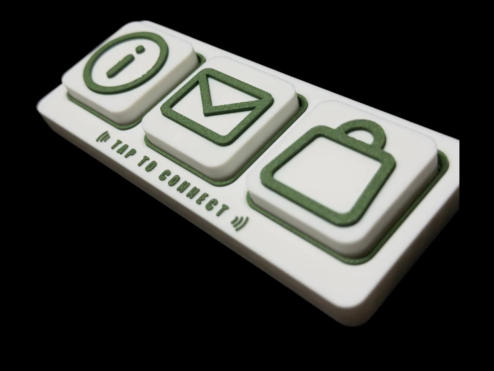 Tap Essential 3 at an angle with three tiles in place: info, email and shop.